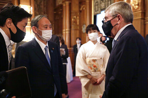 Japanese PM Suga says world should see safe Olympics staged